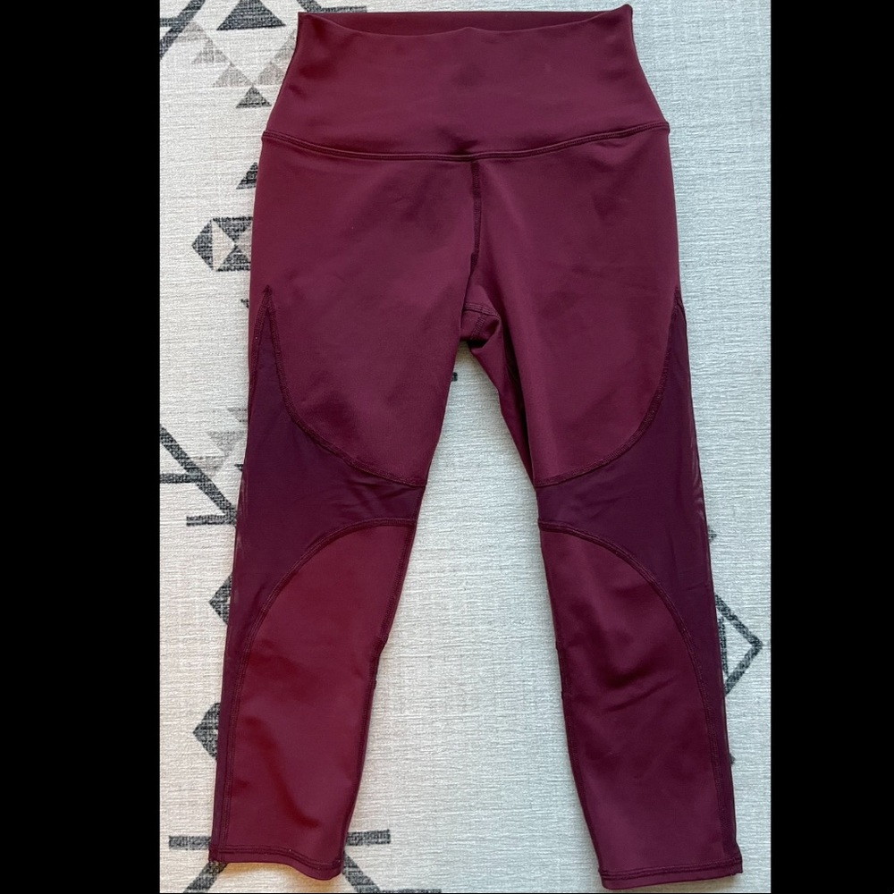 Alo Coast Capri size small, crop length with mesh detail- cranberry color